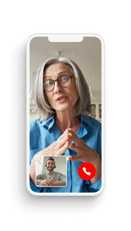 Video call on a smartphone screen shows a woman in a blue shirt and a man in a small window, both engaged in conversation.